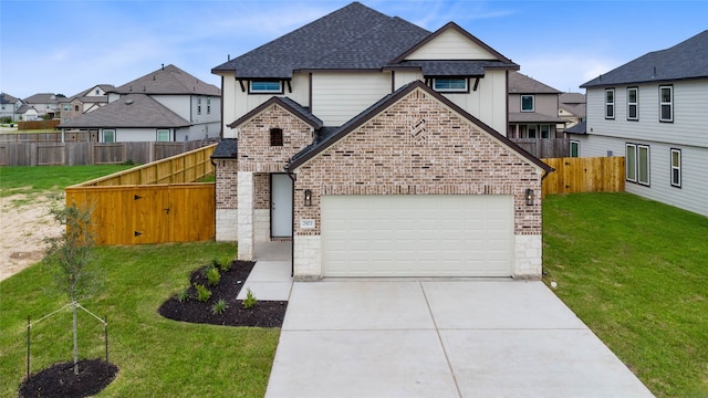 view of front of house with a garage and a front yard