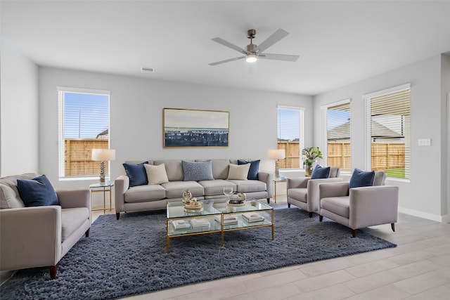 living room featuring hardwood / wood-style flooring and ceiling fan