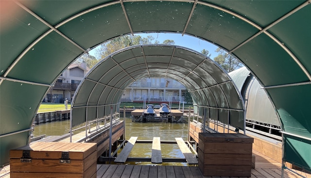 dock area featuring a water view