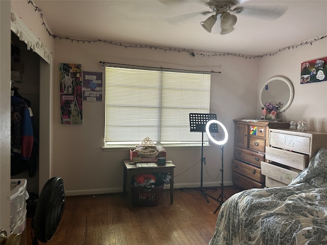 bedroom with ceiling fan and dark hardwood / wood-style flooring