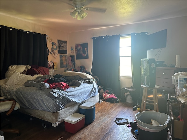 bedroom featuring hardwood / wood-style flooring and ceiling fan