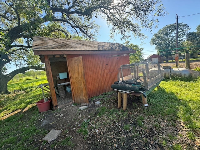 view of outdoor structure featuring a yard