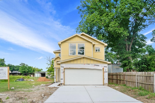 view of front of house with a garage and a front yard