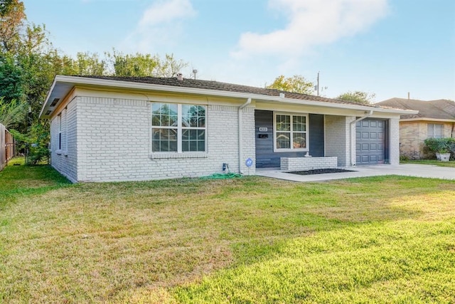 ranch-style home with a garage and a front lawn