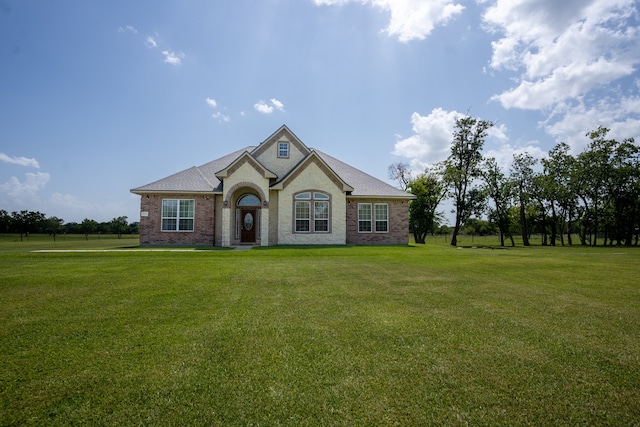 view of front of home featuring a front lawn