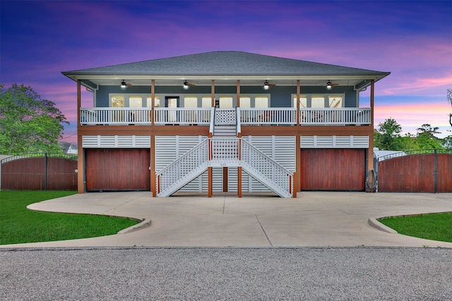 view of front of home with ceiling fan and a garage