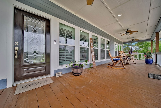 wooden terrace featuring ceiling fan