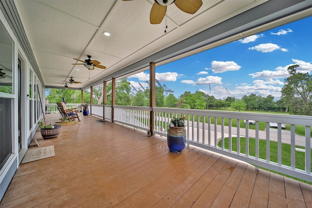 wooden terrace featuring ceiling fan