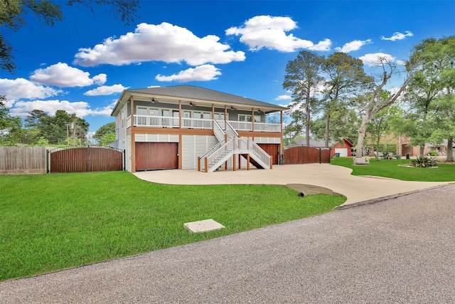 view of front of house with a porch and a front lawn