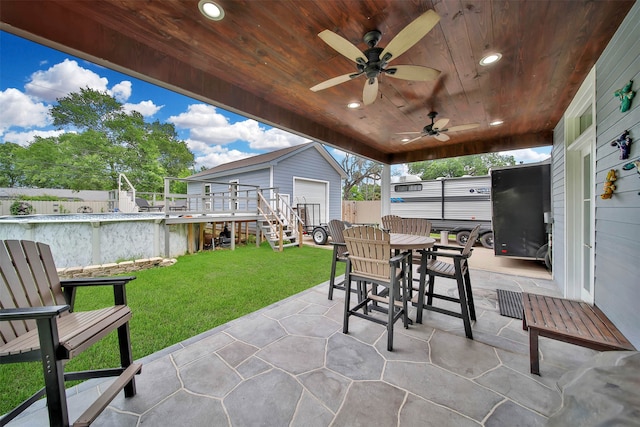 view of patio with a wooden deck and ceiling fan