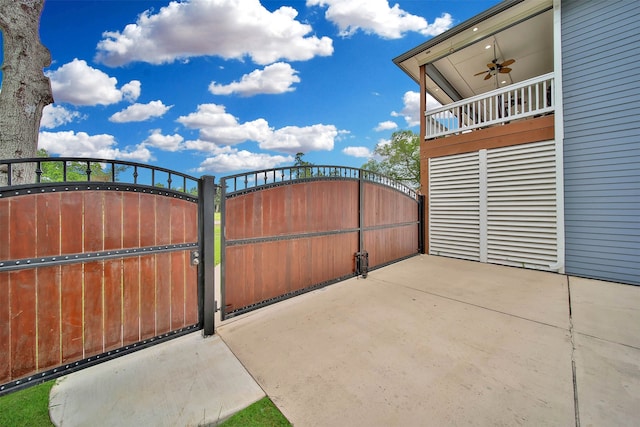 view of gate featuring ceiling fan