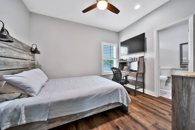 bedroom with ensuite bath, dark wood-type flooring, and ceiling fan