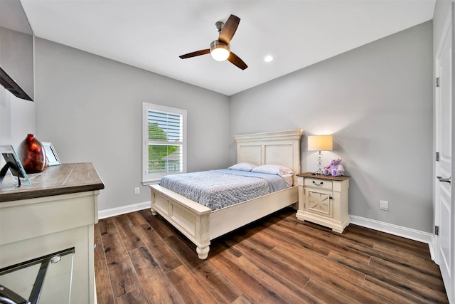 bedroom featuring ceiling fan and dark hardwood / wood-style flooring