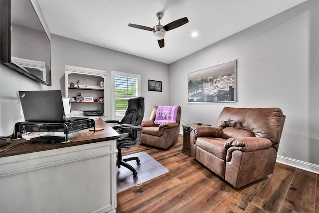 office space featuring ceiling fan and dark hardwood / wood-style floors