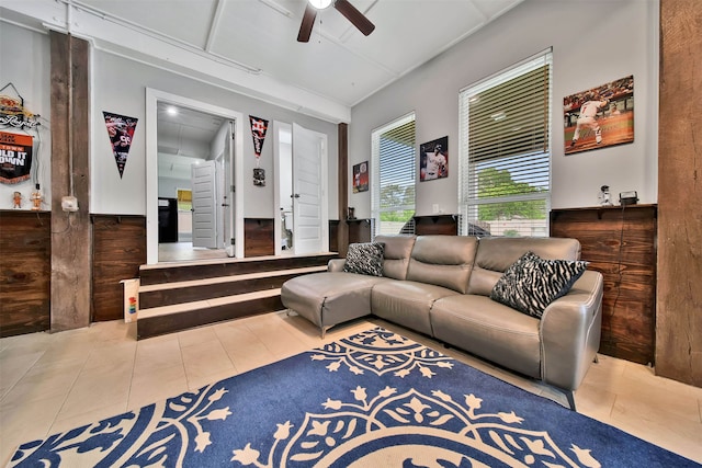 living room featuring ceiling fan and light tile flooring