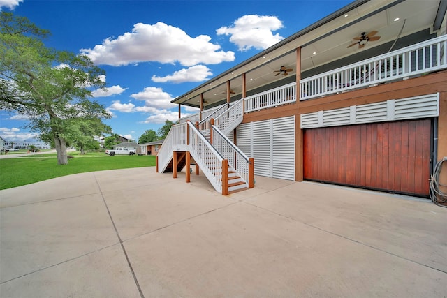 exterior space with ceiling fan and a garage