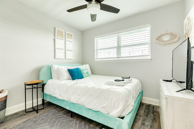 bedroom featuring dark hardwood / wood-style flooring and ceiling fan