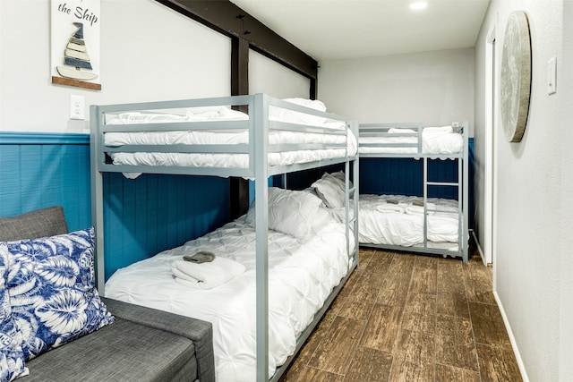 bedroom with dark wood-type flooring