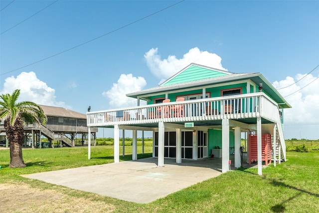 back of property featuring a yard, central air condition unit, and a carport