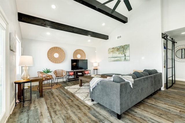 living room with lofted ceiling with beams and dark hardwood / wood-style flooring