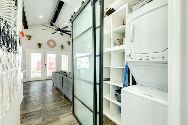 washroom with french doors, ceiling fan, stacked washer and dryer, and hardwood / wood-style floors