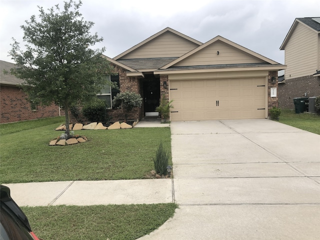 view of front facade with a garage and a front lawn