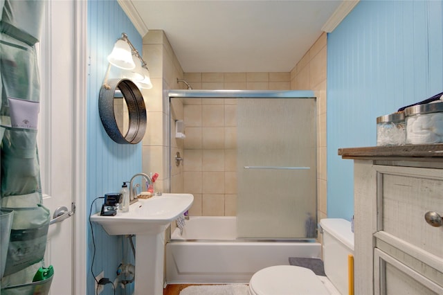 bathroom with toilet, crown molding, and enclosed tub / shower combo