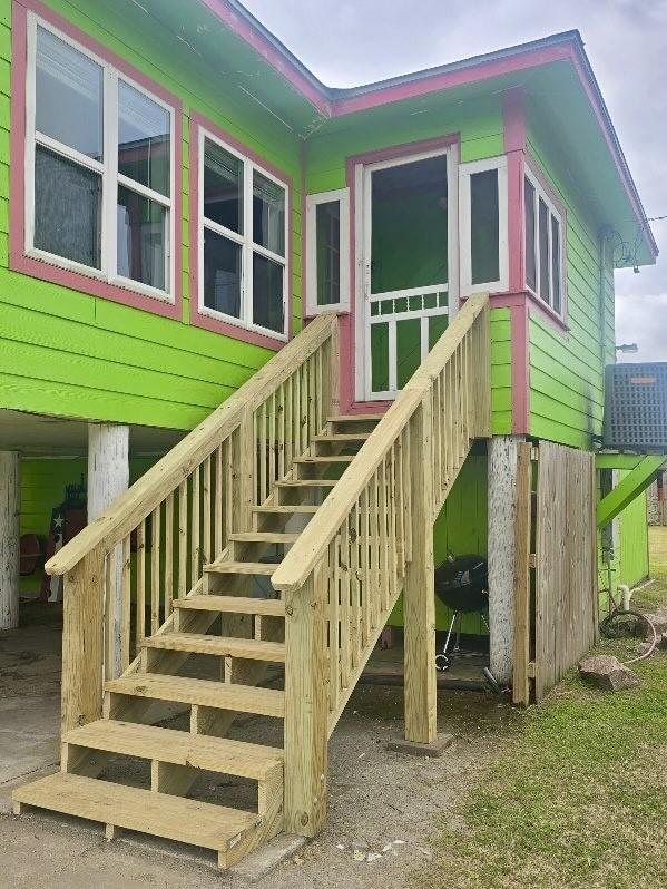 doorway to property featuring cooling unit