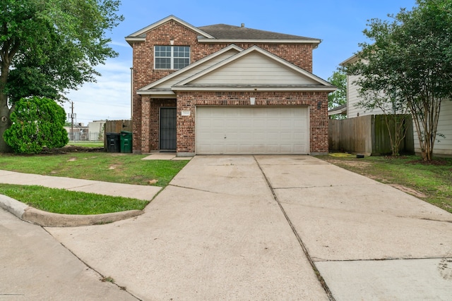 view of front of home featuring a front lawn and a garage