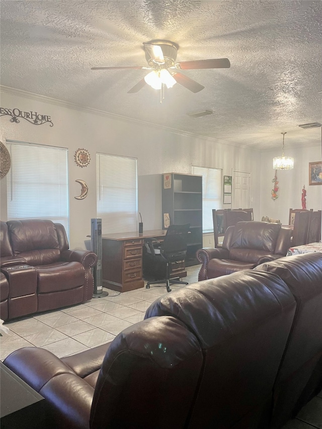 living room with a textured ceiling, light tile patterned floors, and ceiling fan with notable chandelier