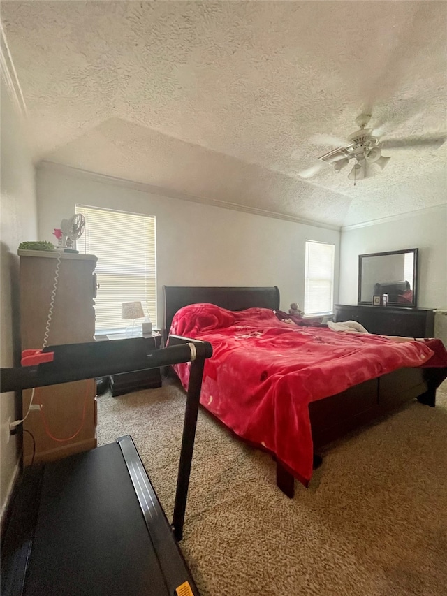 bedroom featuring ceiling fan, a textured ceiling, and carpet floors