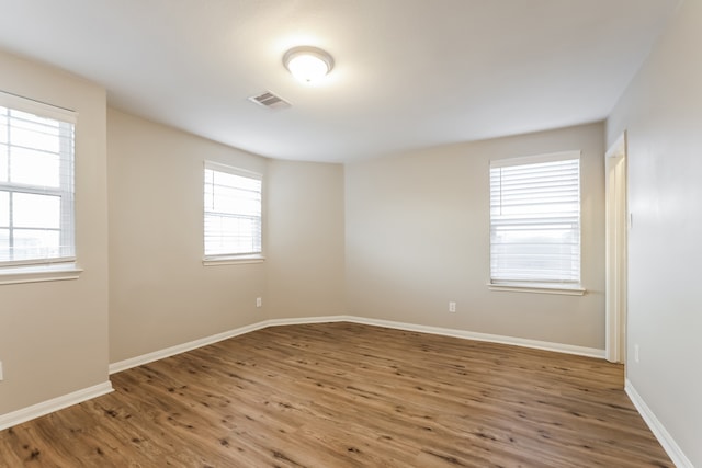 empty room featuring dark hardwood / wood-style flooring