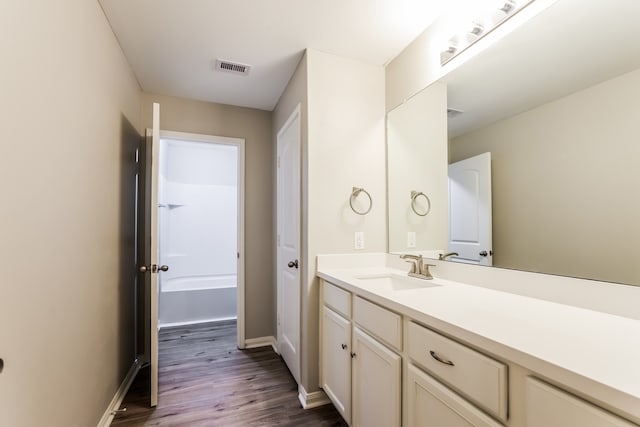 bathroom with wood-type flooring and vanity