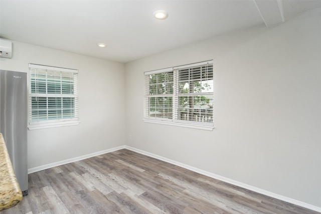 spare room featuring wood-type flooring