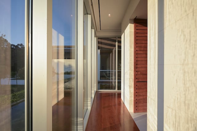 hall with dark wood-type flooring