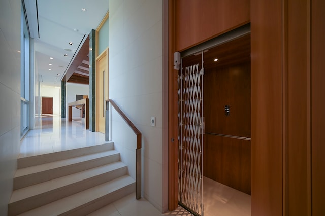 stairs with light tile flooring