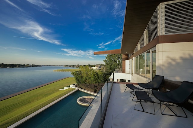 balcony featuring a water view