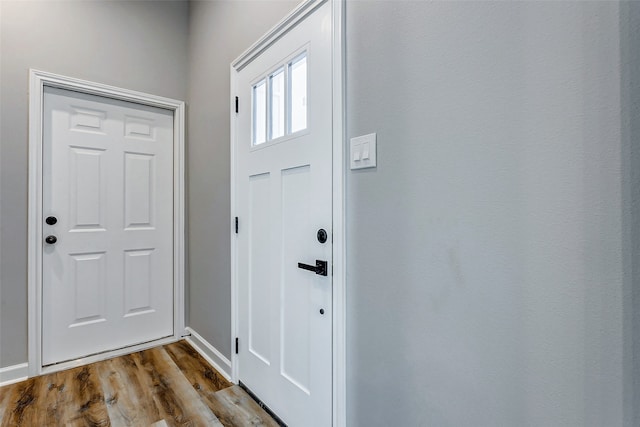 doorway to outside with hardwood / wood-style flooring