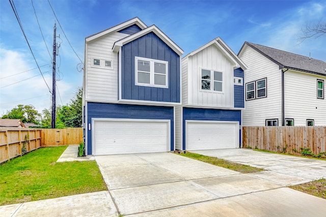 view of front facade with a front yard and a garage