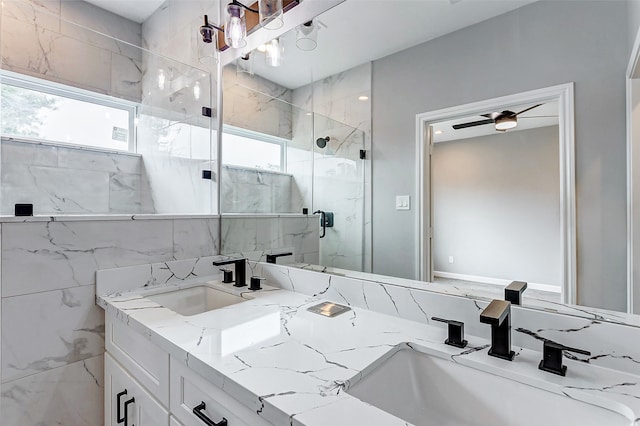 bathroom featuring vanity, an enclosed shower, and ceiling fan