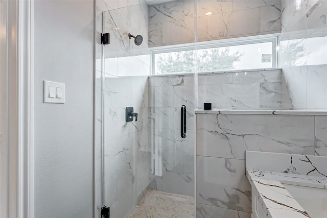 bathroom with an enclosed shower and vanity