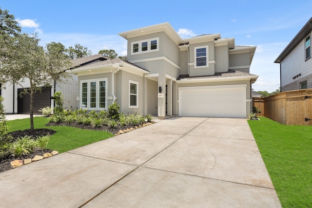 view of front of house with a garage and a front lawn