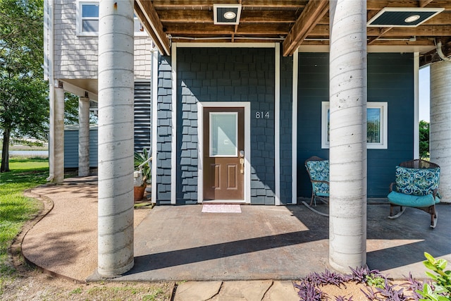 property entrance with a patio