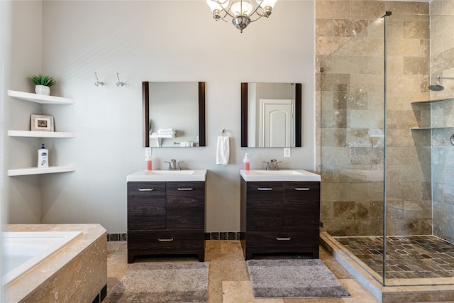 bathroom with plus walk in shower, an inviting chandelier, tile patterned floors, and dual vanity