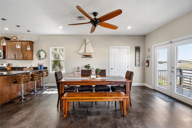 dining space with dark hardwood / wood-style flooring, french doors, and ceiling fan