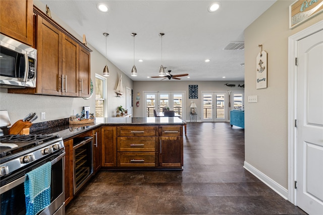 kitchen with stainless steel appliances, french doors, ceiling fan, beverage cooler, and dark hardwood / wood-style flooring