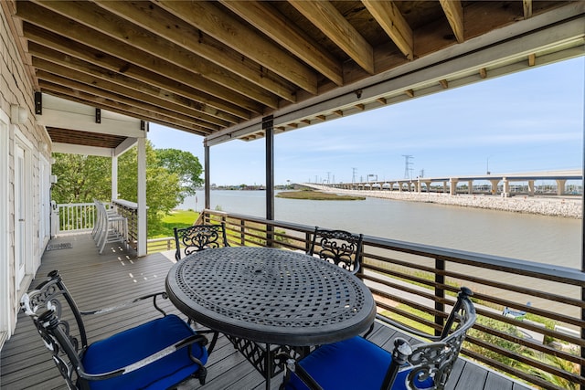 wooden terrace with a water view