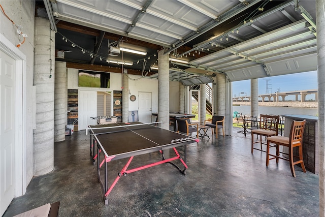 recreation room with a water view