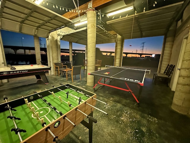 game room with concrete flooring