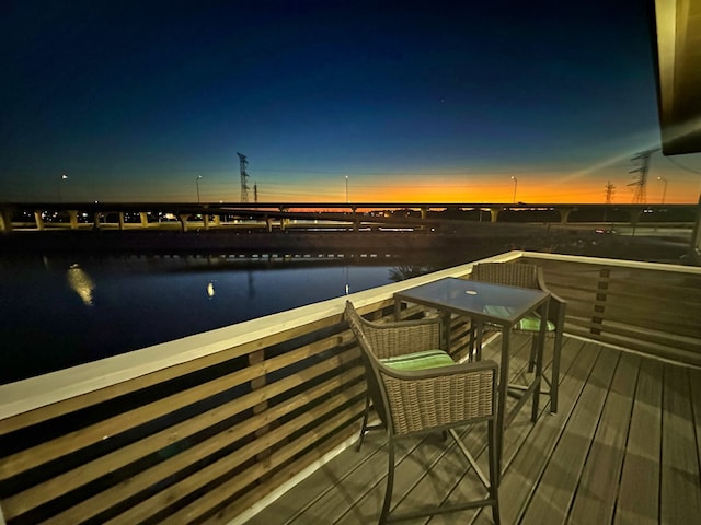 deck at dusk with a water view